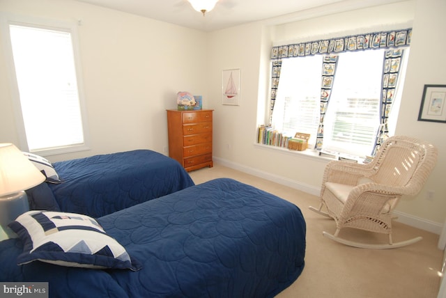 bedroom featuring baseboards and carpet floors