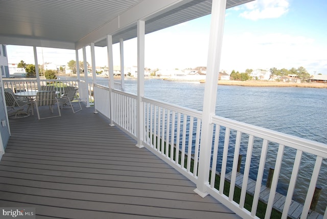 wooden terrace with a water view