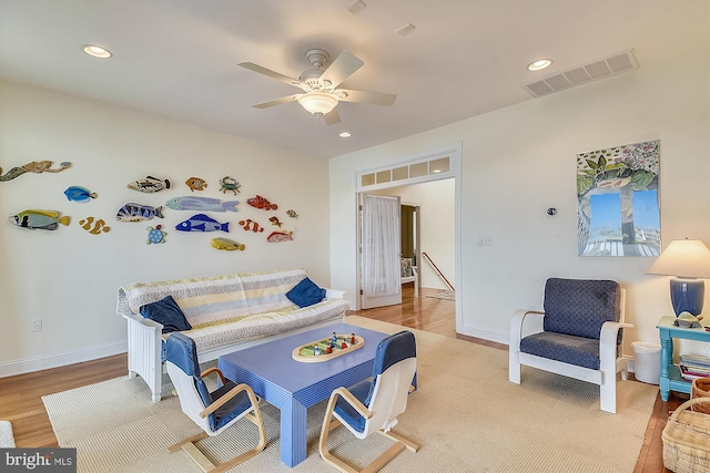 playroom featuring visible vents, light wood-style flooring, a ceiling fan, recessed lighting, and baseboards