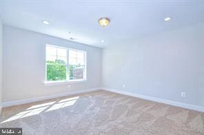 empty room with recessed lighting, baseboards, and carpet floors