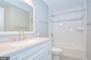 full bathroom with toilet, vanity, and shower / tub combination