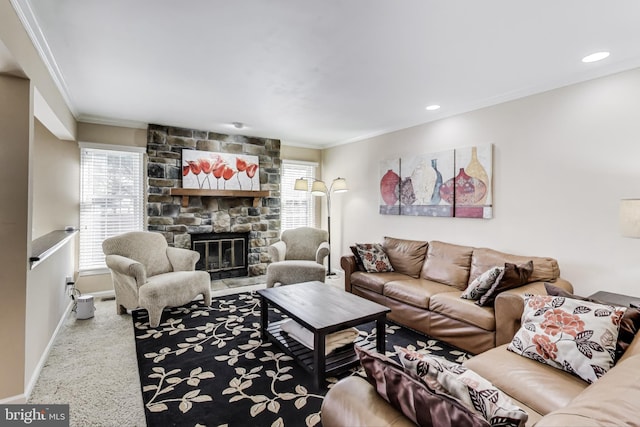 carpeted living room with recessed lighting, baseboards, a stone fireplace, and ornamental molding