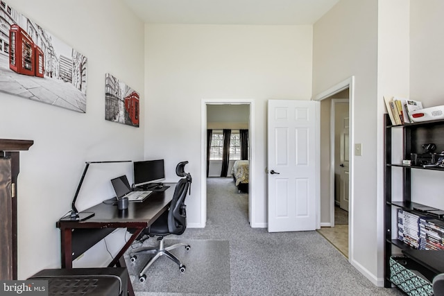 office featuring baseboards and carpet floors