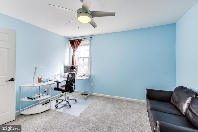 office space featuring a ceiling fan, baseboards, and carpet floors