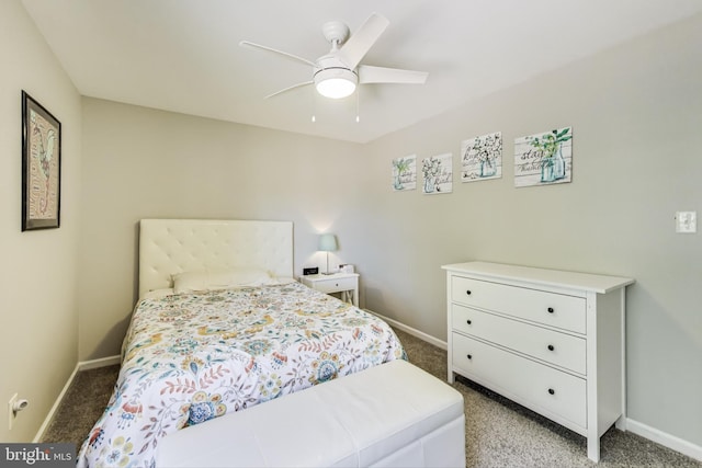 bedroom featuring baseboards and light colored carpet