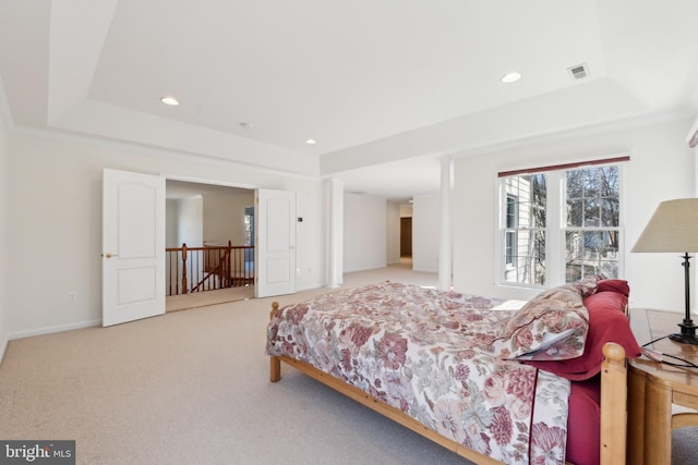 bedroom featuring recessed lighting, visible vents, a raised ceiling, and carpet floors