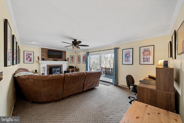 carpeted living room with a ceiling fan, a fireplace, and ornamental molding