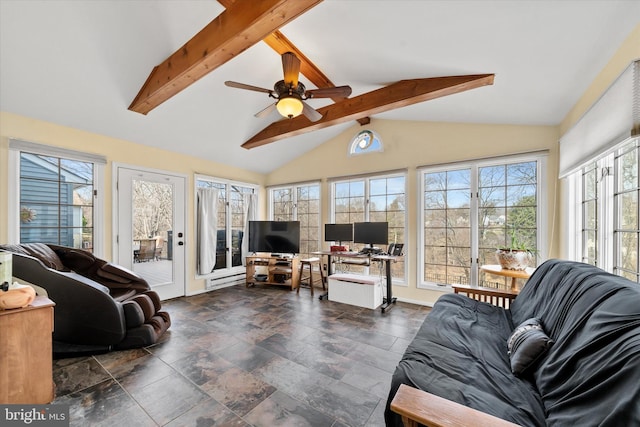 living room featuring lofted ceiling with beams, a ceiling fan, and stone finish flooring