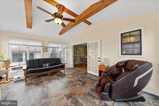 living area with a ceiling fan, stone finish floor, french doors, baseboards, and vaulted ceiling with beams