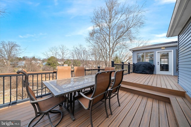 deck with outdoor dining space