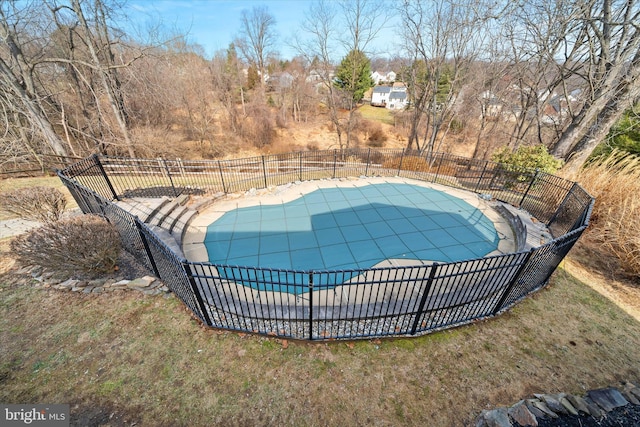 view of pool featuring a fenced in pool, a yard, and fence