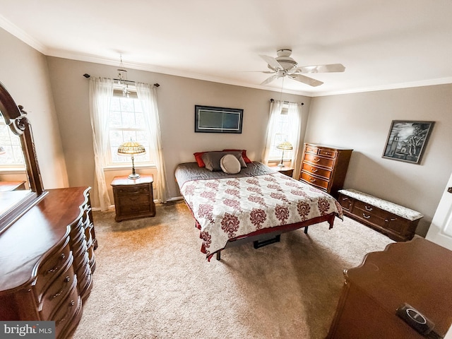 bedroom featuring ceiling fan, carpet, and ornamental molding