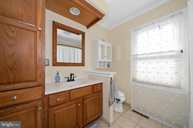 bathroom with visible vents, crown molding, toilet, tile patterned floors, and vanity