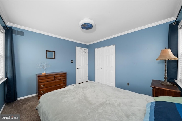 carpeted bedroom featuring visible vents, baseboards, a closet, and crown molding