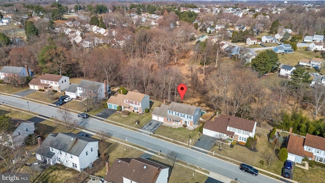 birds eye view of property with a residential view