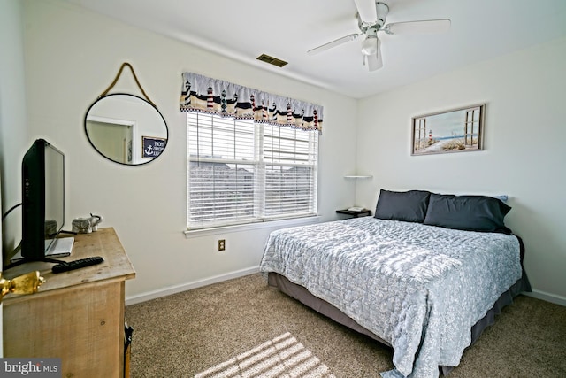 bedroom featuring visible vents, baseboards, ceiling fan, and carpet flooring