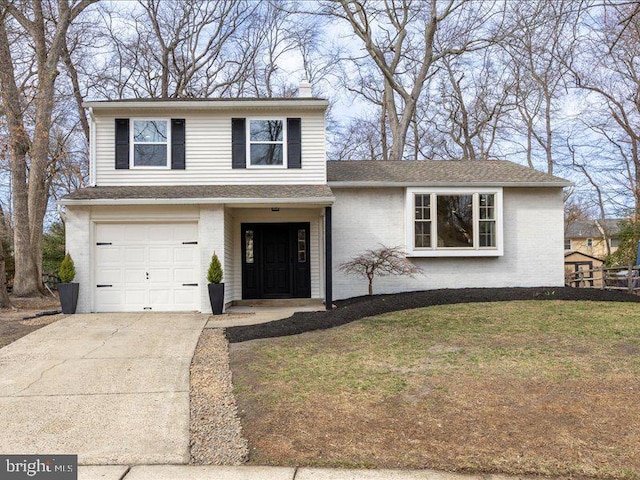 view of front facade featuring concrete driveway, brick siding, a garage, and a front yard