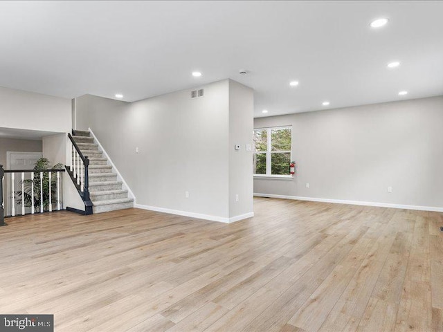 interior space with recessed lighting, light wood-type flooring, baseboards, and visible vents