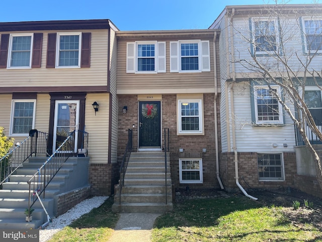 view of property with brick siding