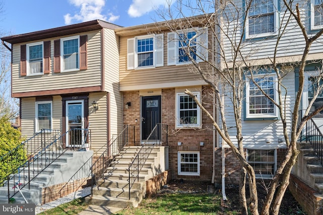 view of property featuring brick siding