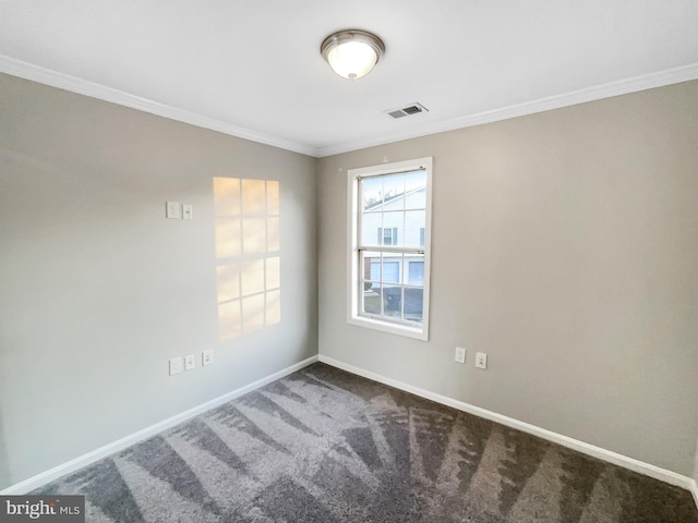 spare room with visible vents, baseboards, carpet floors, and ornamental molding