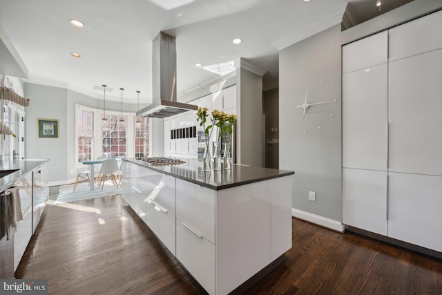 kitchen featuring white cabinets, island exhaust hood, modern cabinets, and stainless steel gas stovetop