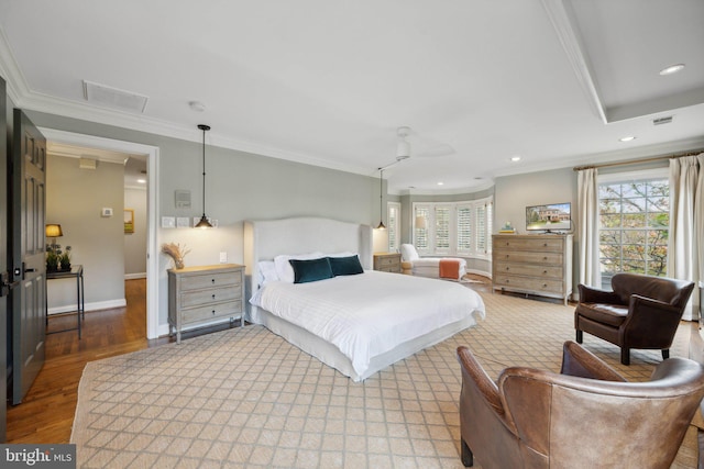 bedroom featuring recessed lighting, visible vents, multiple windows, and crown molding