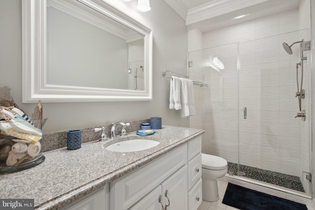 bathroom featuring tile patterned flooring, a shower stall, crown molding, toilet, and vanity