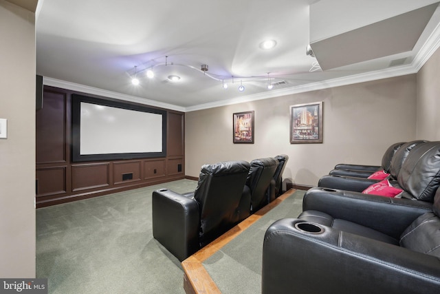 home theater featuring visible vents, light carpet, ornamental molding, and track lighting