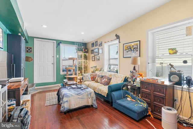 living area with recessed lighting and hardwood / wood-style flooring