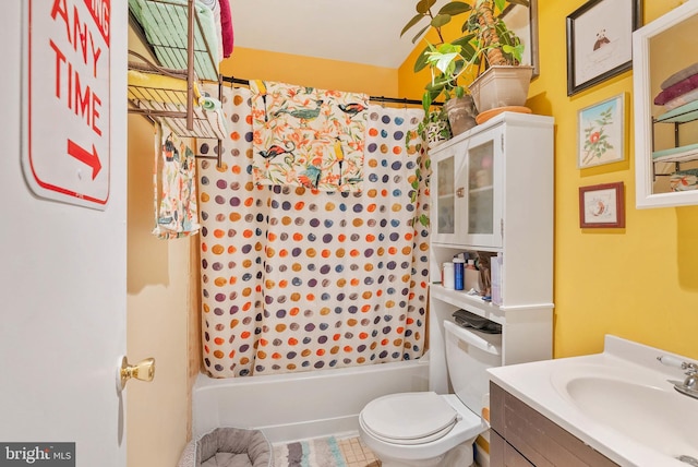 bathroom featuring shower / bathtub combination with curtain, toilet, and vanity