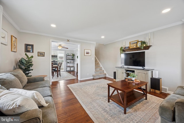 living area featuring baseboards, recessed lighting, stairs, dark wood-type flooring, and crown molding