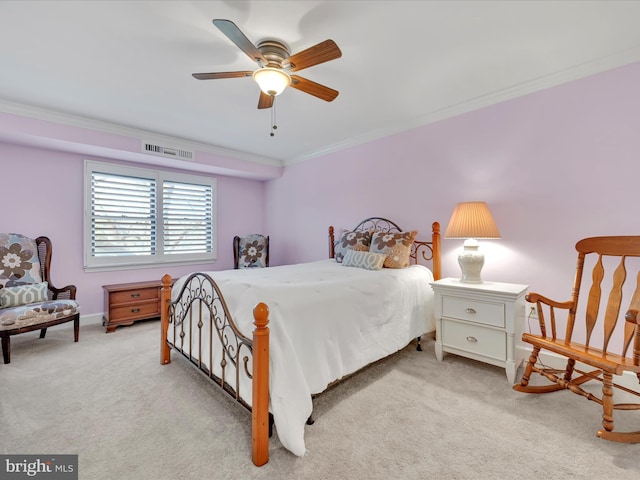 bedroom with visible vents, carpet floors, a ceiling fan, and crown molding