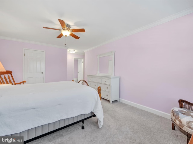 bedroom featuring crown molding, a ceiling fan, baseboards, and light carpet