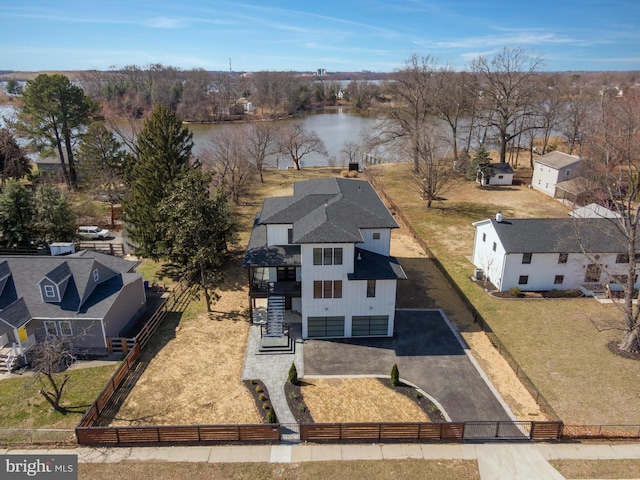 birds eye view of property featuring a water view