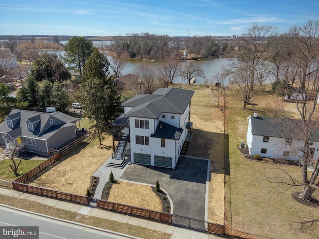 birds eye view of property with a water view