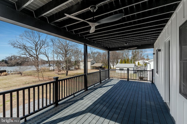 wooden terrace featuring a water view