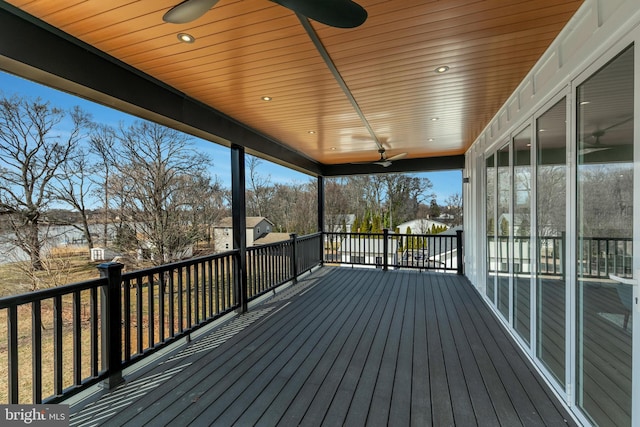 wooden terrace with a ceiling fan