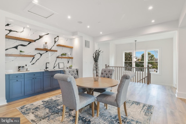 dining area with recessed lighting, visible vents, baseboards, and light wood finished floors