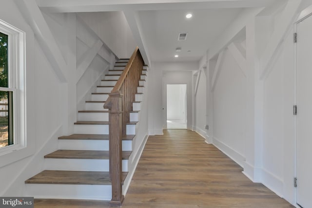 interior space featuring recessed lighting, visible vents, plenty of natural light, and wood finished floors