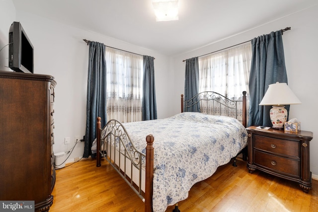 bedroom with wood finished floors