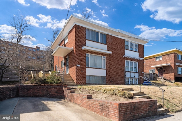 view of front of home with brick siding