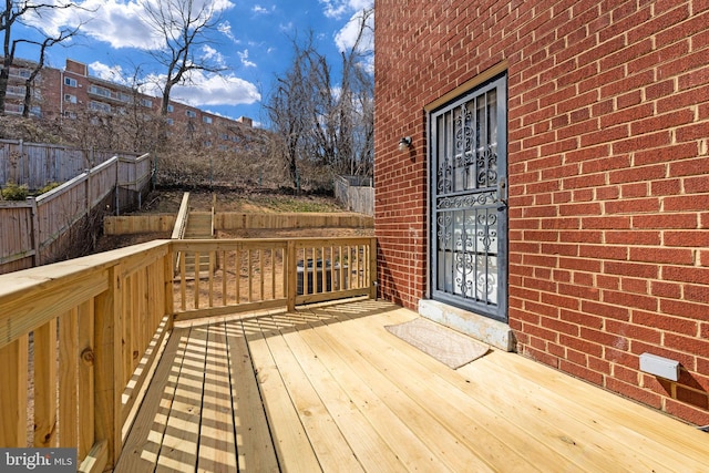 wooden deck featuring fence