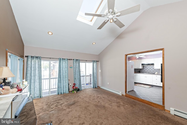 unfurnished living room with high vaulted ceiling, baseboard heating, a skylight, and carpet flooring