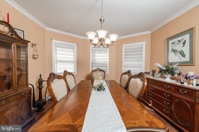 dining room with a baseboard radiator, wood finished floors, an inviting chandelier, and ornamental molding