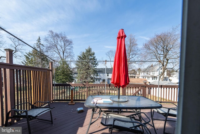 wooden deck with outdoor dining space