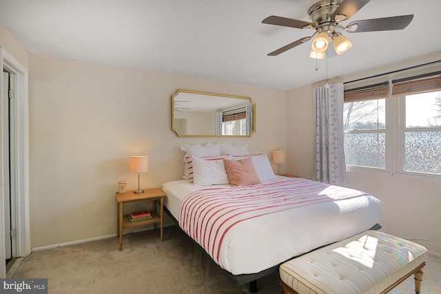 bedroom with baseboards, light carpet, and a ceiling fan