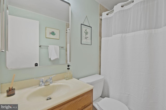 bathroom featuring vanity, toilet, and a shower with curtain