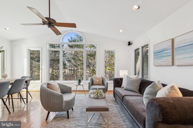 living room featuring ceiling fan, lofted ceiling, wood finished floors, and recessed lighting