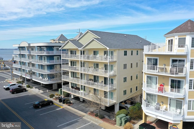 view of property with uncovered parking